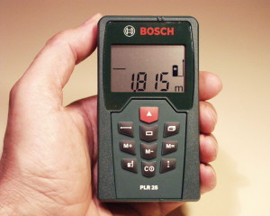 A laser measure is used to get the dimensions of the property.