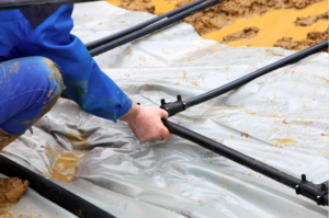 installing pipes for ground source heat pump