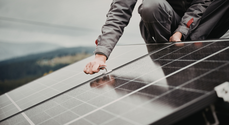 Solar photovoltaic system installed on a residential rooftop in the UK to reduce electricity bills